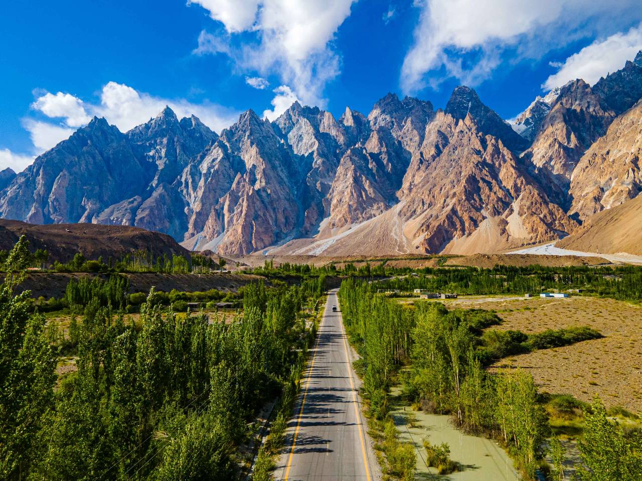 Sunset view over northern Pakistan with green hills and urban landscape